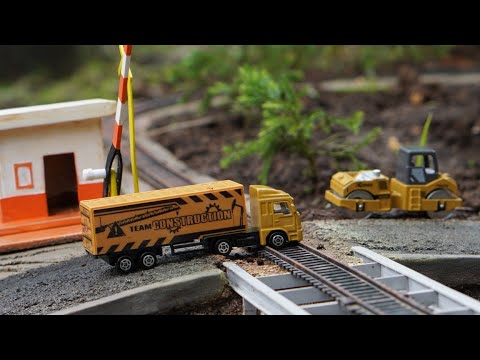 Toy Train - Truck Cars Pass The Railroad Tracks