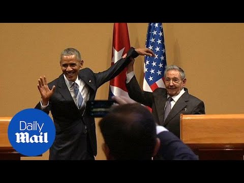 Castro grabs Obama&#039;s arm and raises it after conference - Daily Mail